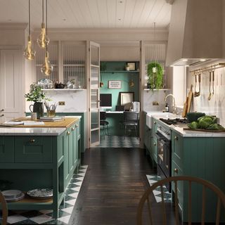 kitchen area with green cabinets and flower vase