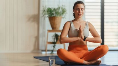 Yoga for energy: A woman doing yoga at home