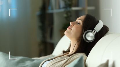 Woman with headphones listening to brown noise for sleep apps