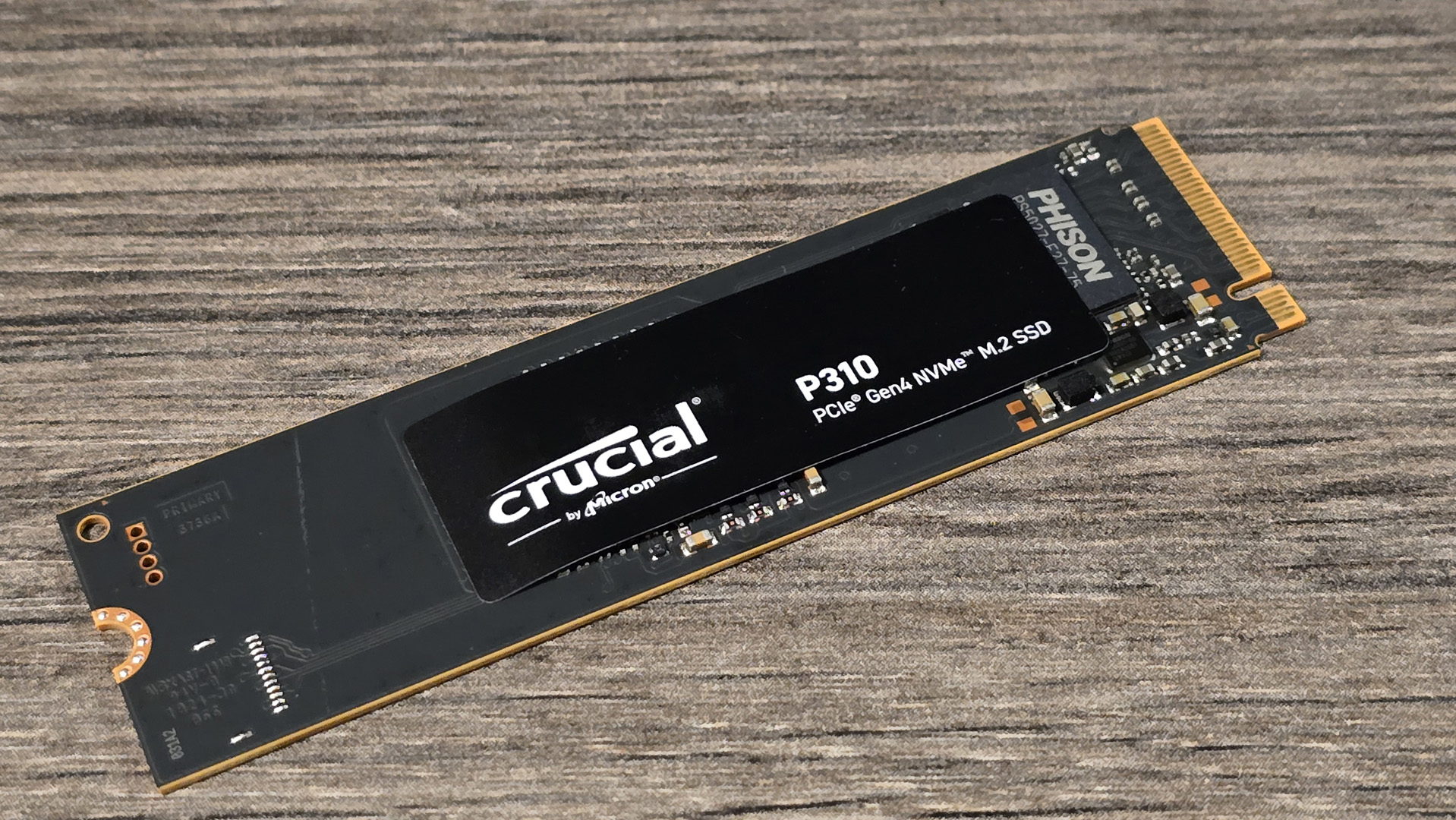 A Crucial P310 SSD installed inside a gaming PC.