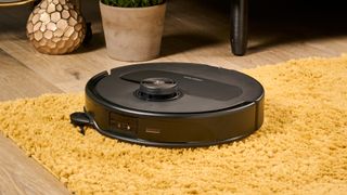 Roborock Qrevo Master robot vacuum with side brush kicked out 