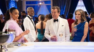 RhonniRose Mantilla as Chelsea Hamilton, Peter Bergman as Jack Abbot and Susan Walters as Diane Jenkins standing at a bar in formalwear in Beyond the Gates