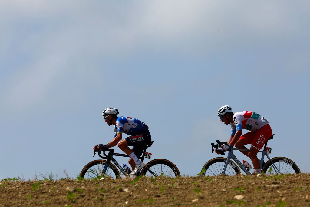 Team Soudal-Quick Step's French rider Julian Alaphilippe (L) and Team Polti-Kometa's Italian rider Mirco Maestri ride in Monsano during the 12th stage of the 107th Giro d'Italia cycling race, 193km between Martinsicuro and Fano, on May 16, 2024. (Photo by Luca Bettini / AFP)