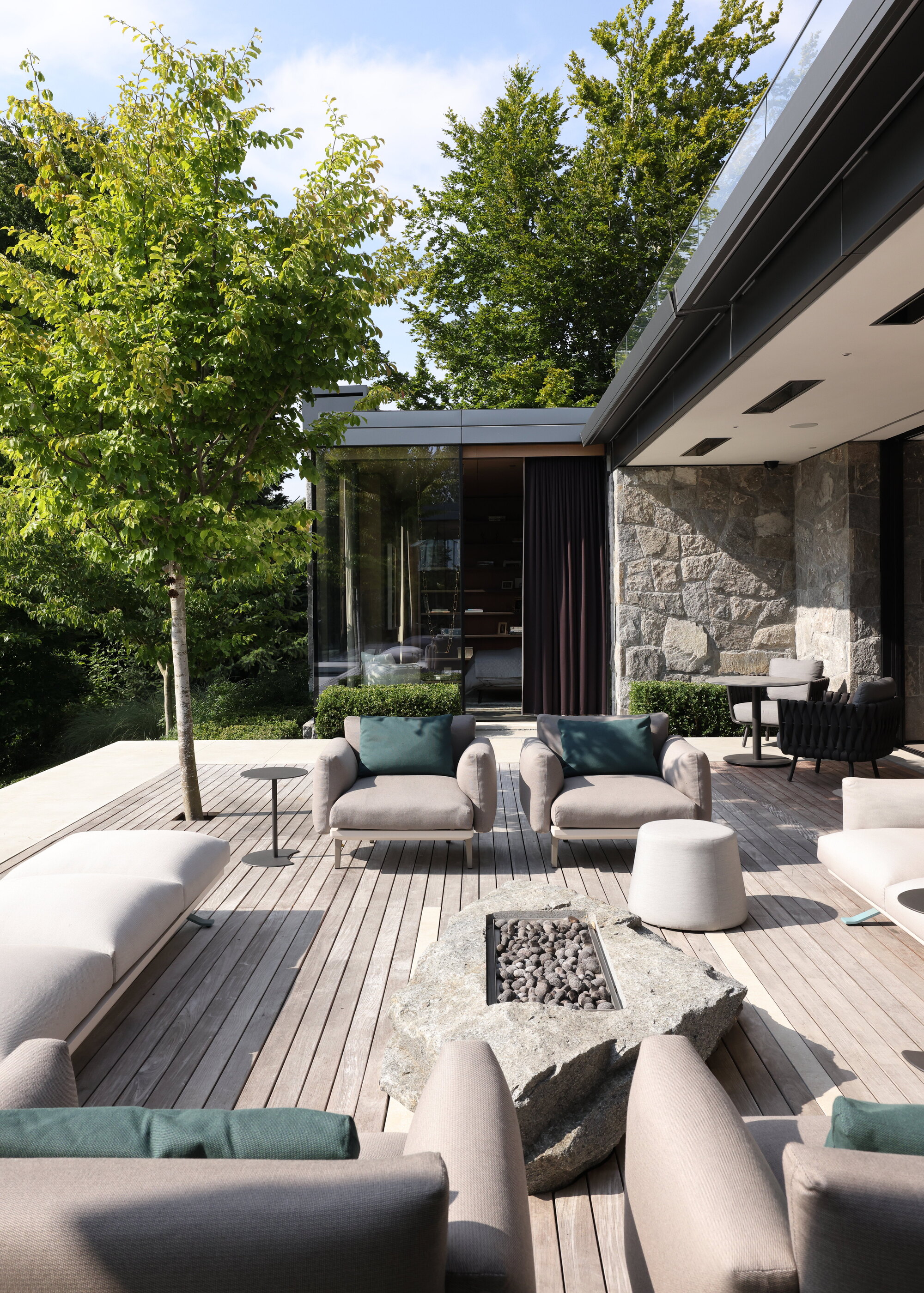 timber decking with outdoor furniture and firepit