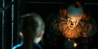 Pennywise beckoning a little girl to come to him