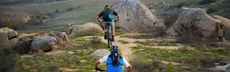 Two people biking in the mountains