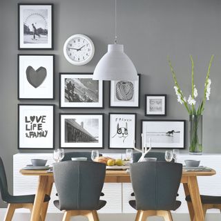 Grey dining room with black and white gallery wall