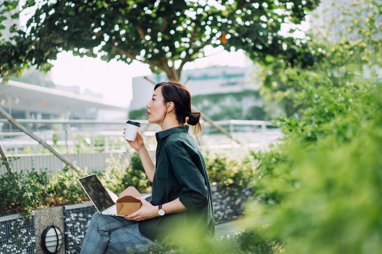 Green investing: A woman investing on her laptop