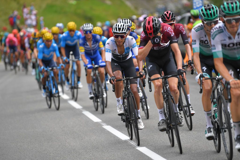 Egan Bernal sits on the wheels before his attack