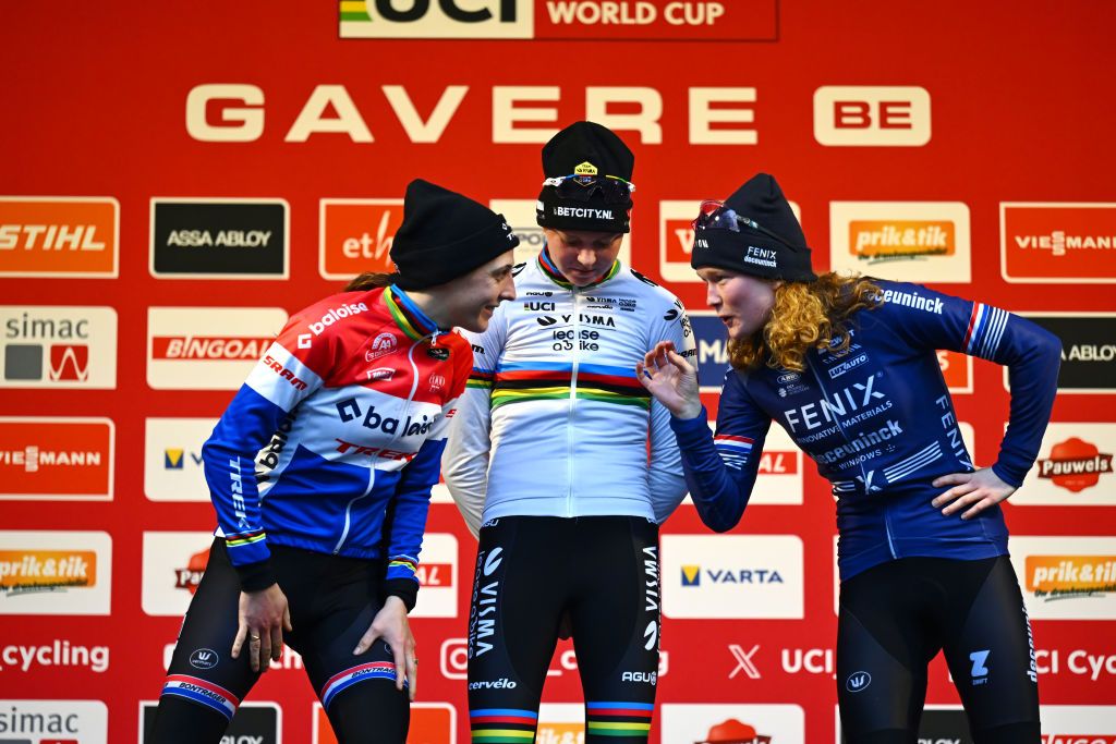 GAVERE BELGIUM DECEMBER 26 LR Lucinda Brand of The Netherlands and Team Baloise Trek Lions on second place race winner Fem Van Empel of The Netherlands and Team Visma Lease A Bike and Puck Pieterse of The Netherlands and Team FenixDeceuninck on third place pose on the podium ceremony after the 3rd UCI Cyclocross World Cup Gavere 2024 Womens Elite on December 26 2024 in Gavere Belgium Photo by Luc ClaessenGetty Images