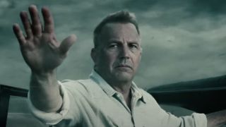 Kevin Costner's Jonathan Kent holding up his hand before being swept away by tornado