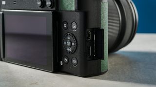 A photograph of the Panasonic Lumix S9 rear controls and side panel
