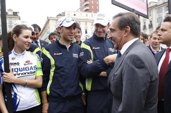 The Liquigas riders are greeted by the local minister