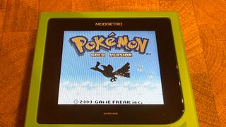 Modretro Chromatic with Pokemon Gold on the screen