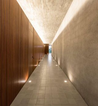 Concrete and tiles exaggerate the sense of perspective in the corridor