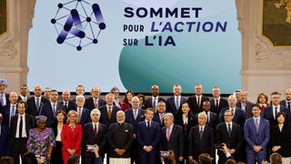 France's President Emmanuel Macron (front C) poses for a group picture with world leaders and attendees at the end of the plenary session of the AI Action Summit.