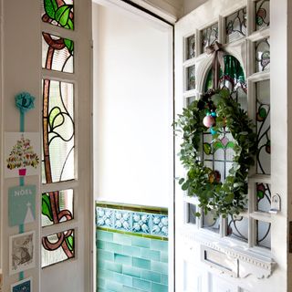 white door with garland and white walls