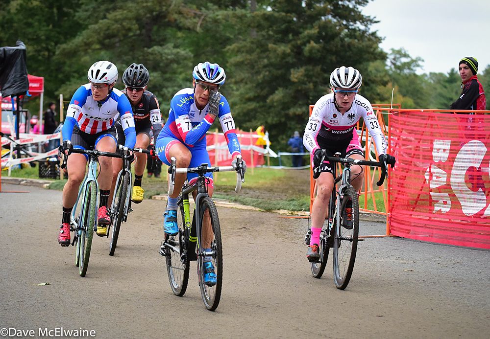 Katerina Nash (Luna Pro Team) sitting up on the pavement after lap one