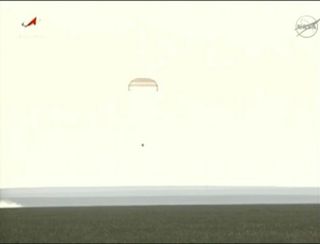 A Soyuiz TMA-04M space capsule floats toward Earth under its parachute, just moments before landing on the steppes of Kazakhstan to return Expedition 32 crewmembers Gennady Padalka, Sergei Revin (both of Russia) and NASA astronaut Joe Acaba to Earth on Sept. 16, 2012 EDT (Sept. 17 local time).