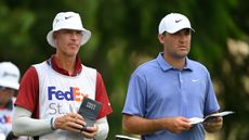 Ted Scott (left) and Scottie Scheffler weigh up a shot during the 2025 FedEx St Jude Championship