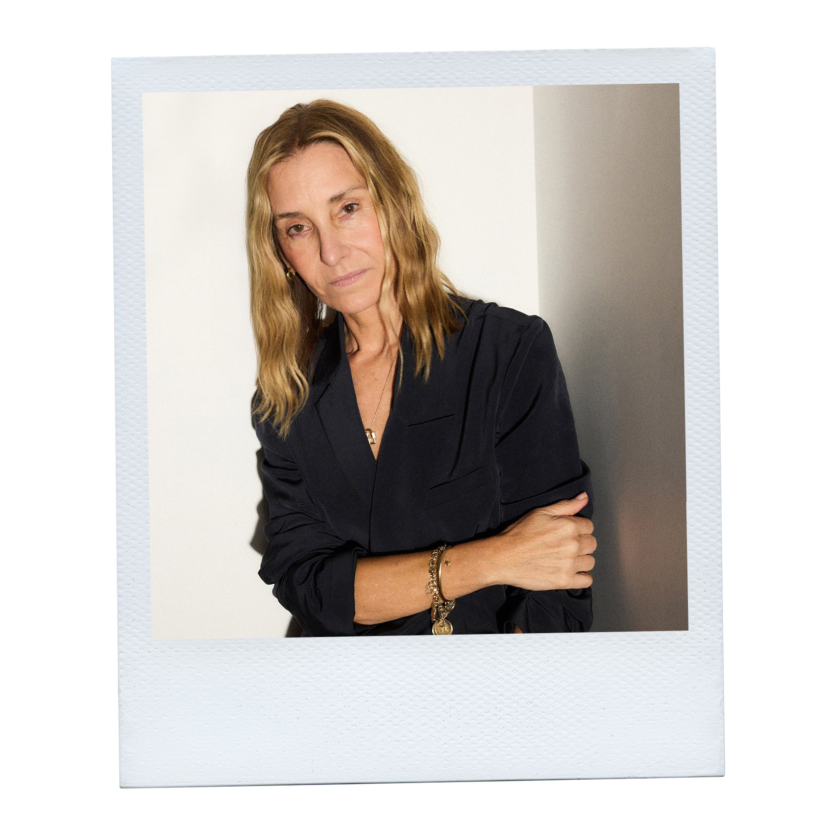 Amy smilovic in a black blazer in a Polaroid