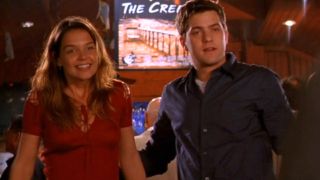Joshua Jackson and Katie Holmes facing forward in Dawson's Creek.