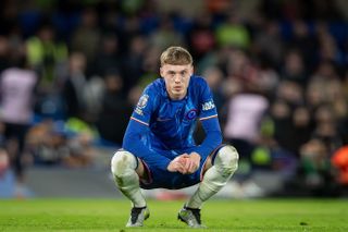 Chelsea's Cole Palmer crouches while waiting for play to restart in the Premier League match against Southampton at Stamford Bridge on 25 February, 2025