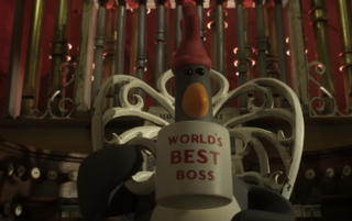 Feathers McGraw holds a mug that reads "World's Best Boss"