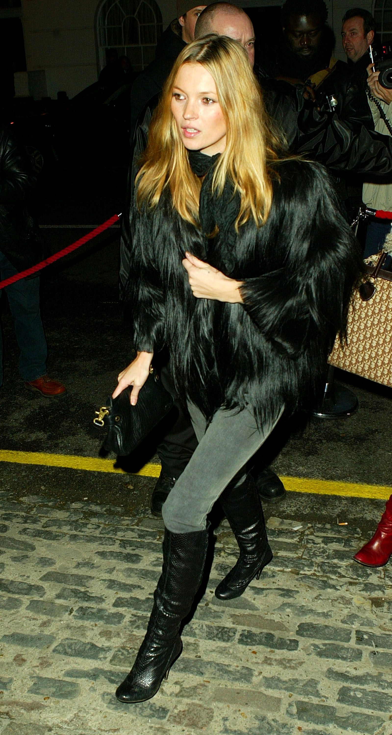 Kate Moss in 2003 wears shoes to wear with grey jeans. This image is from Getty.