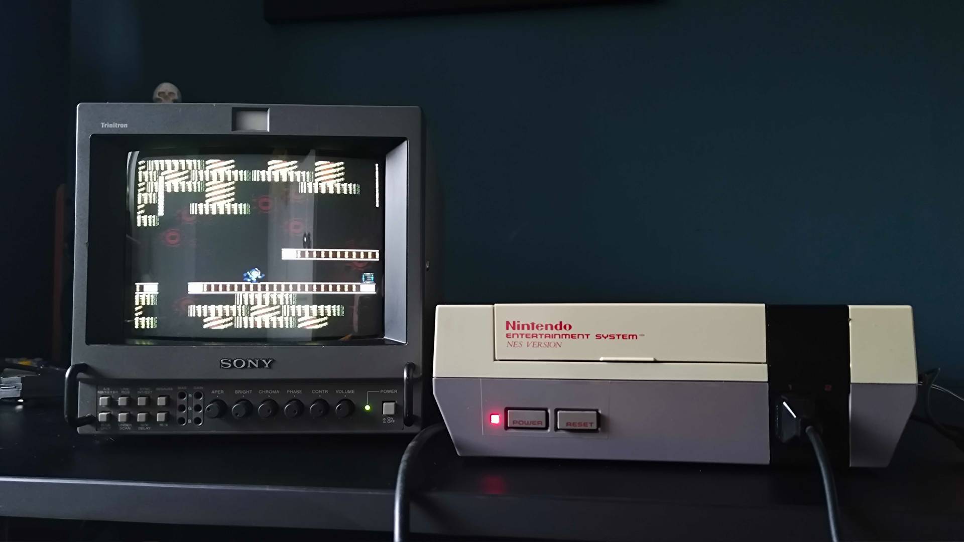 Original PAL NES console connected to Sony PVM CRT TV with Mega Man 2 gameplay on screen.