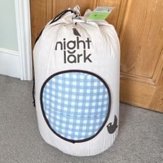 The blue gingham Night Lark Coverless Duvet being tested at home