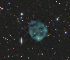 An image of an ORC, by B&auml;rbel Koribalski, based on ASKAP data, with the optical image from the [Dark Energy Survey](https://www.darkenergysurvey.org)