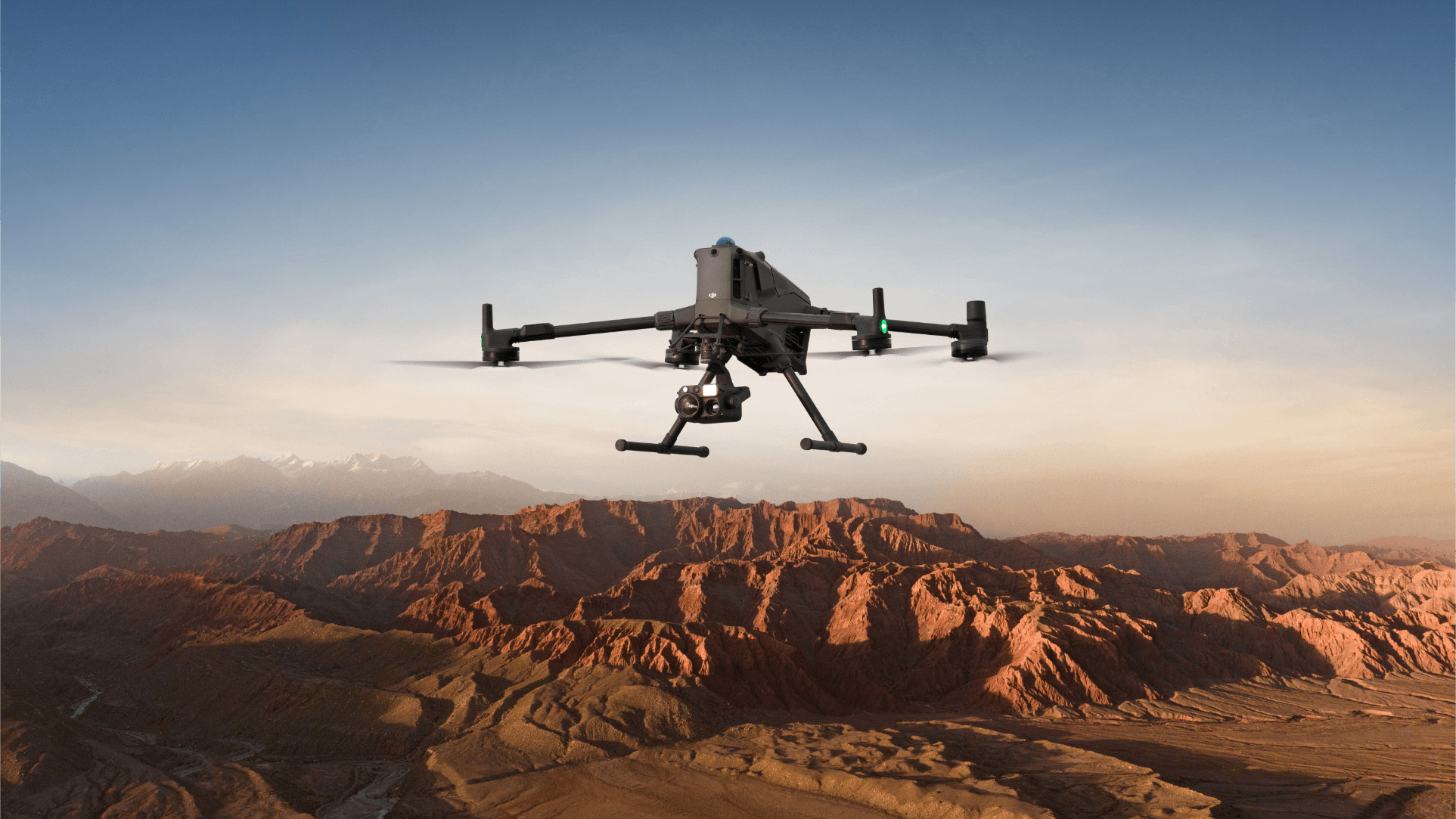 The DJI Matrice 4 in flight over mountains