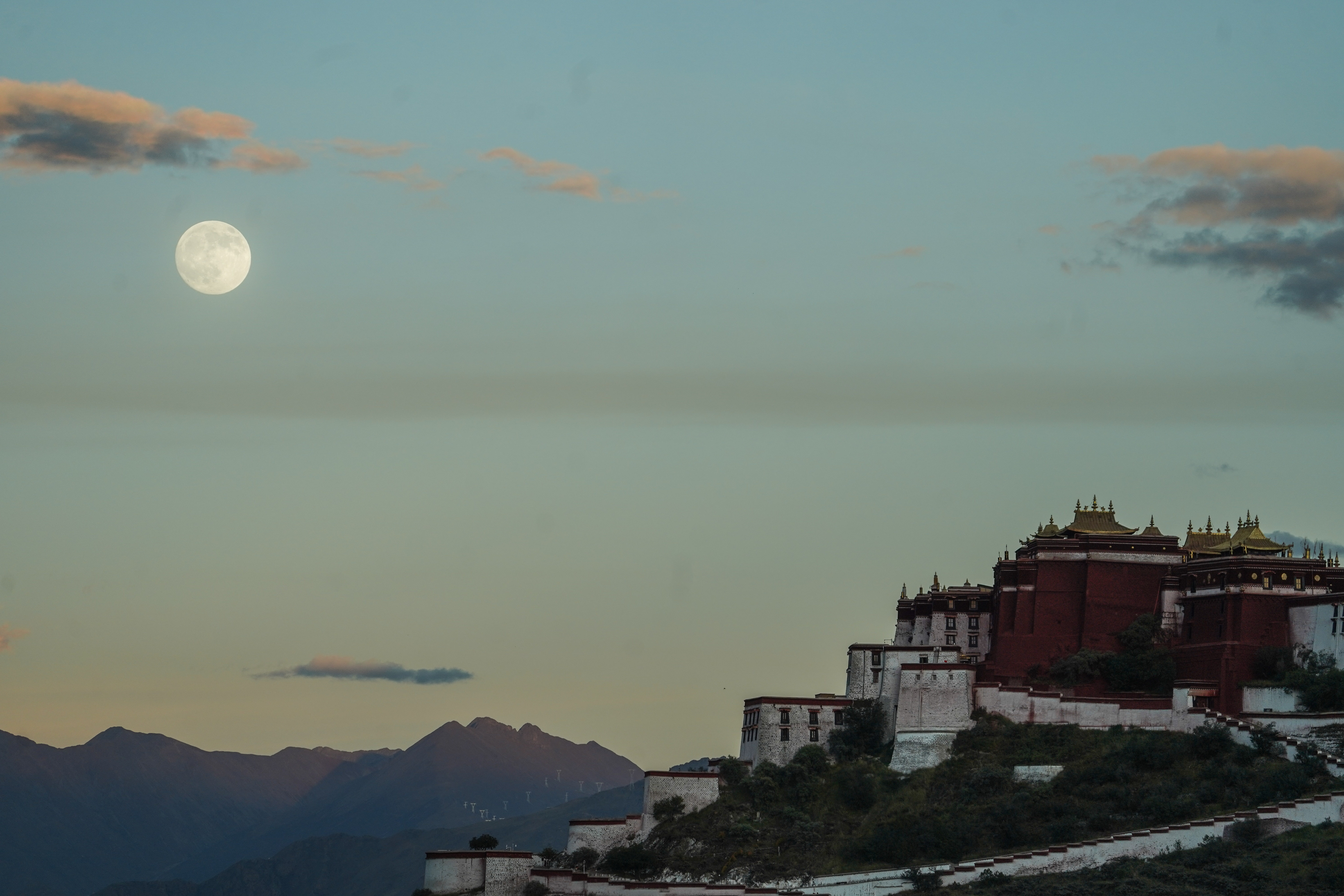 A photograph of the Harvest super moon in the sky near Potala Palace in the autonomous region of Tibet in southwestern China.
