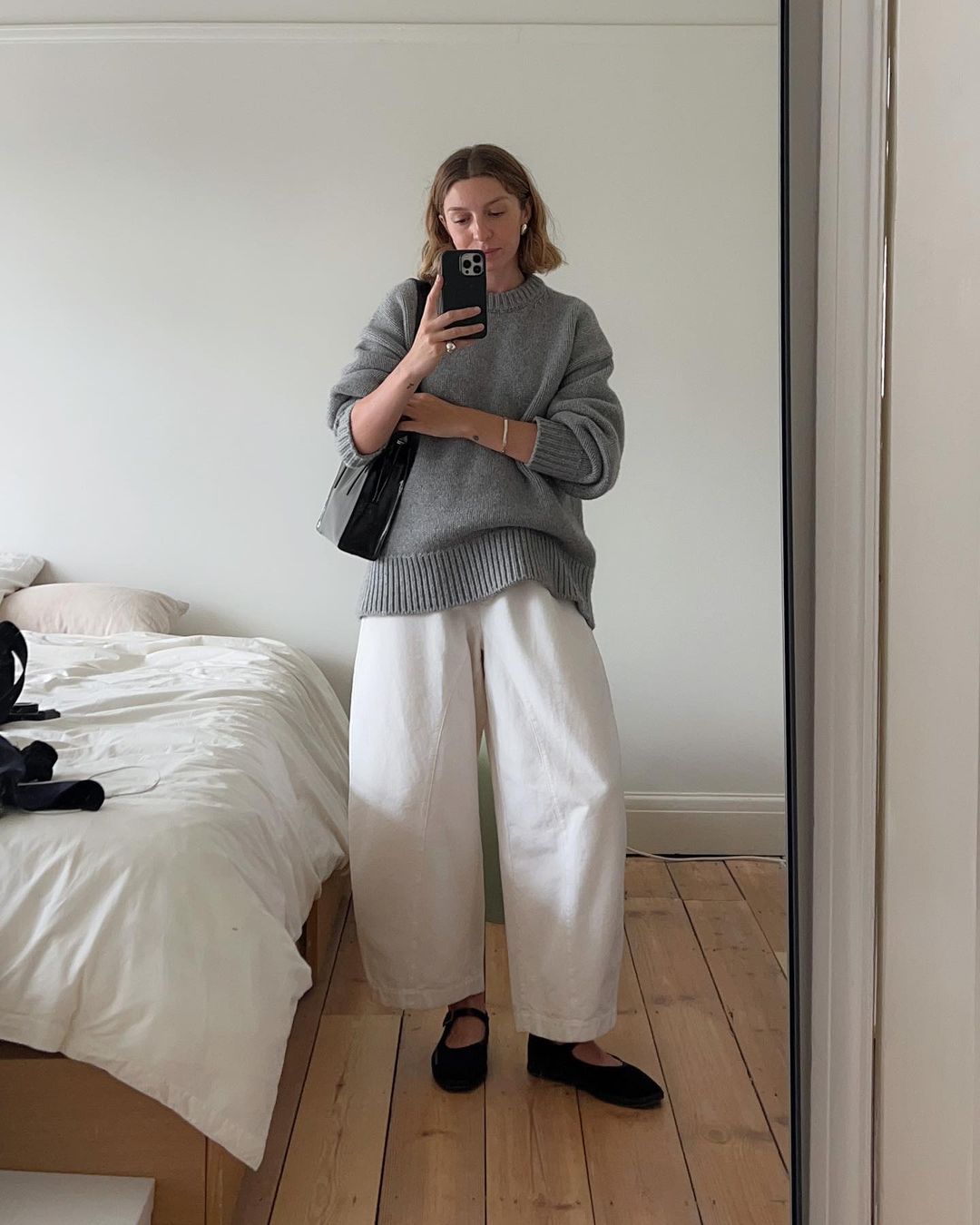 Brittany Bathgate in Mary-Janes with white trousers and jumper