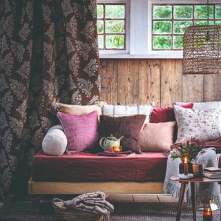 cosy living room with panelled walls and burgundy accents