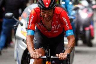 Team Bahrain rider Italys Damiano Caruso rides in the final ascent on his way to win the 20th stage of the Giro dItalia 2021 cycling race 164km between Verbania and Valle Spluga Alpe Motta Madesimo on May 29 2021 Photo by Luca Bettini AFP Photo by LUCA BETTINIAFP via Getty Images