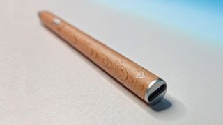 A shot of the Adonit Log stylus on a white desk