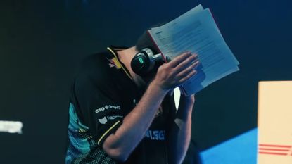 Counter-Strike player with his head in his hands