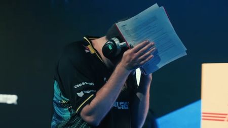 Counter-Strike player with his head in his hands