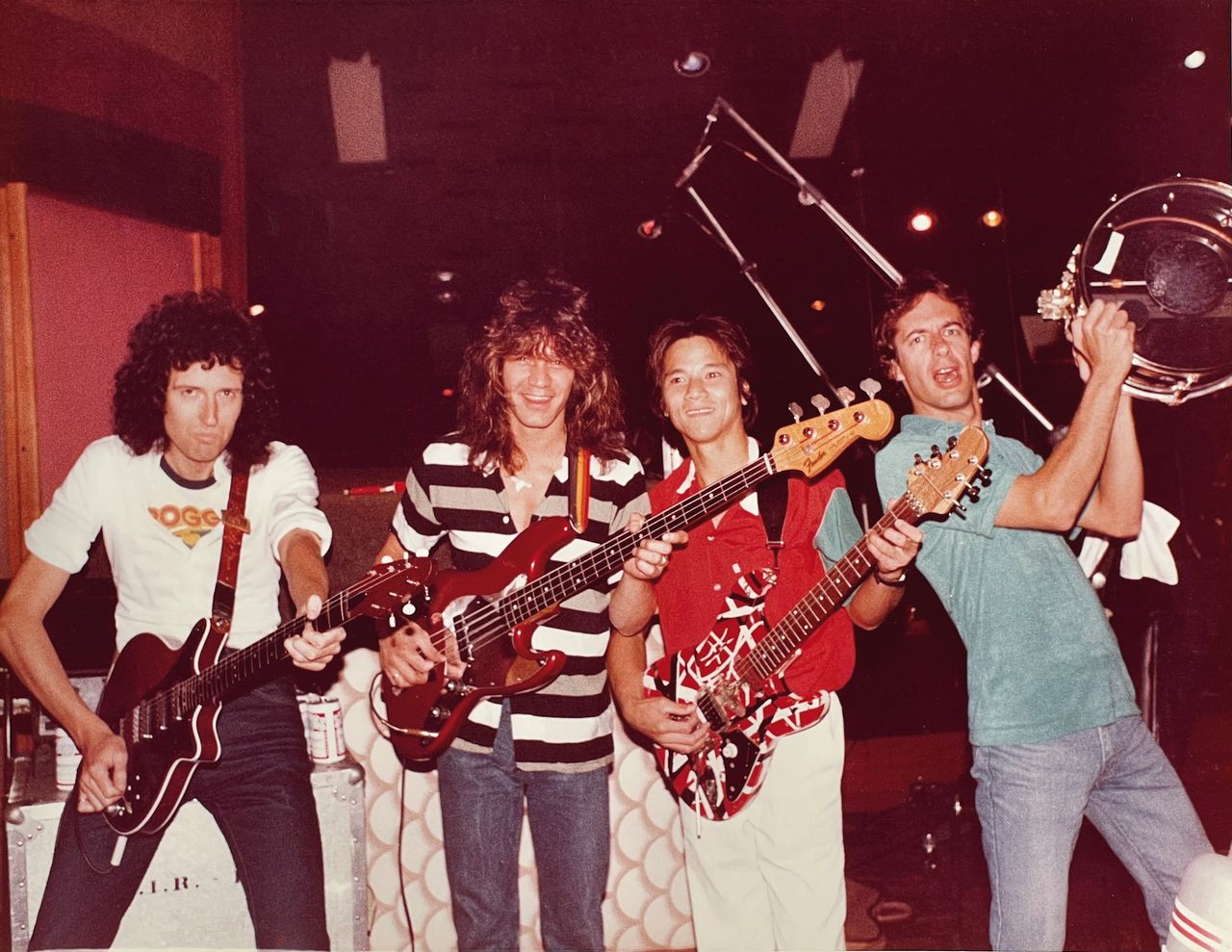 (from left) Brian May, Eddie Van Halen, Phil Chen and Alan Gratzer pose in the studio while working on the Star Fleet Project