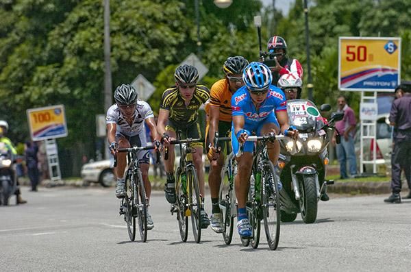 The leading quartet make their way through the second sprint point of the day with the peloton closing in.