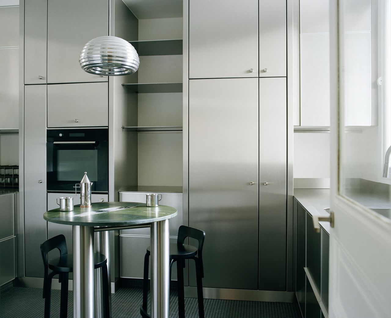 silver kitchen with olive green table