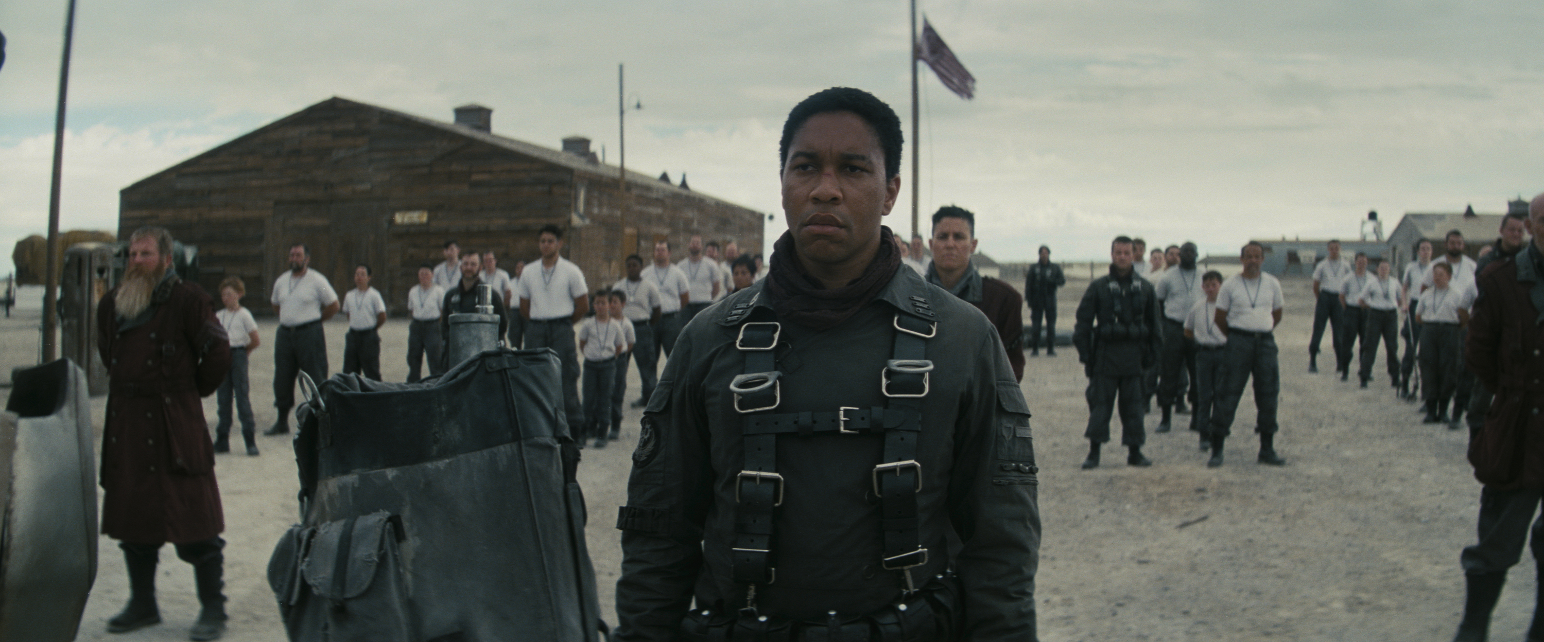 maximus (aaron moten) stands among a field of soldiers on a military base, in 'fallout'