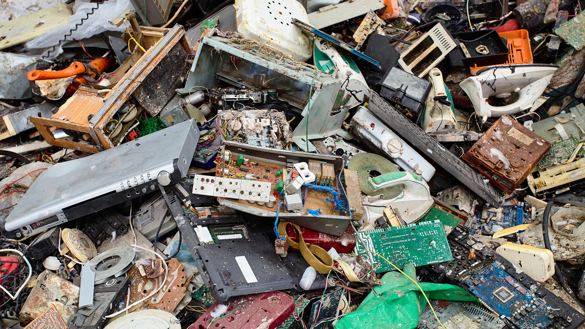 A close-up photo of e-waste in a scrapheap, to represent end of life software.