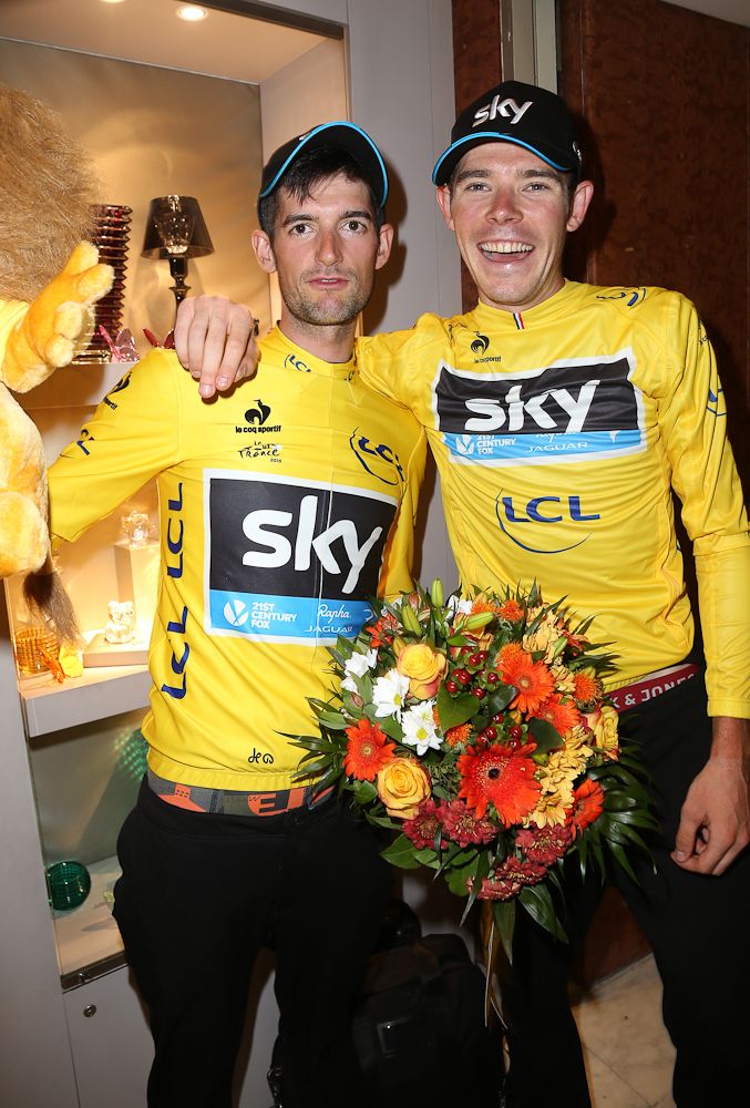 Wout Poels and Luke Rowe wear the yellow jersey of their team Sky leader, Chris Froome.