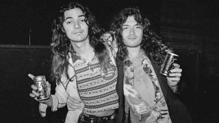 Deep Purple’s Tommy Bolin and Glenn Hughes holding beer cans in 1975