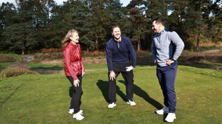 3 golfers laughing on the course