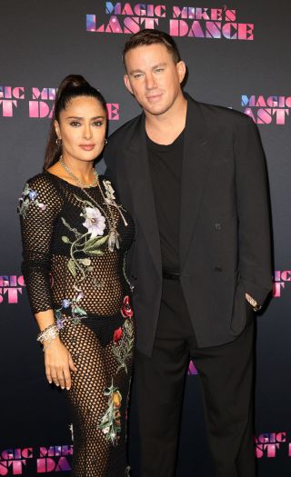 Salma Hayek and Channing Tatum standing arm in arm at the Magic Mike's Last Dance premiere