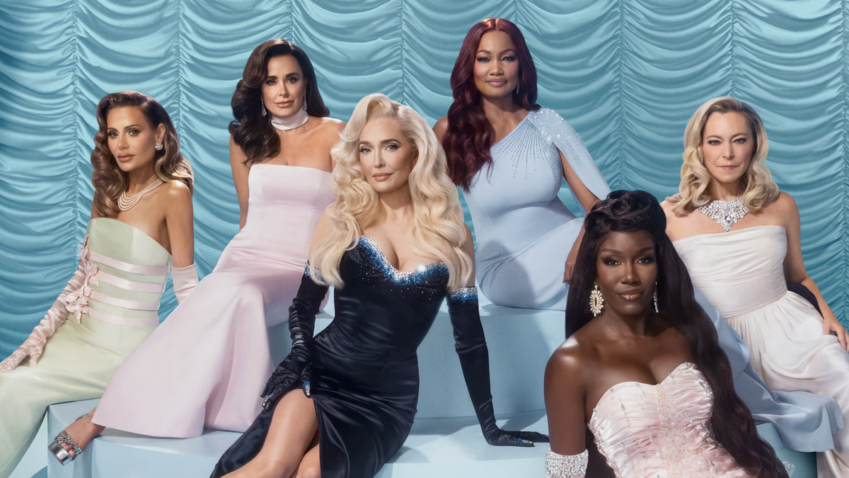 The cast of The Real Housewives of Beverly Hills season 14 assembled in glamorous attire in front of a swagged baby blue backdrop ahead of the 2024 premiere. 